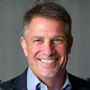 Portrait of James Richardson, a smiling professional man in his 40s.
